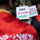 British protestors hold up signs asking the UK government to save Afghan women